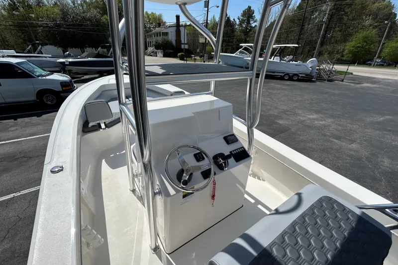 Slide: The Image of 2026 May-Craft 238 Offshore CC boat interior with steering console and seating. - 15