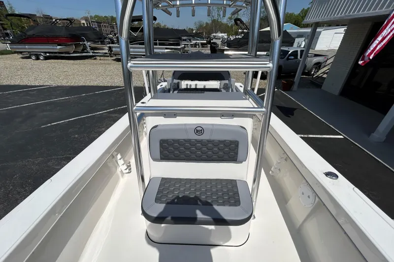 Slide: The Image of 2026 May-Craft 238 Offshore CC boat interior with seating and stainless steel frame. - 17