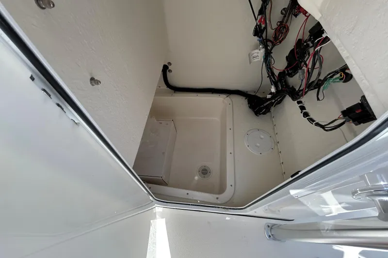 Slide: The Image of Interior view of 2026 May-Craft 238 OFFSHORE CC boat compartment with wiring. - 21