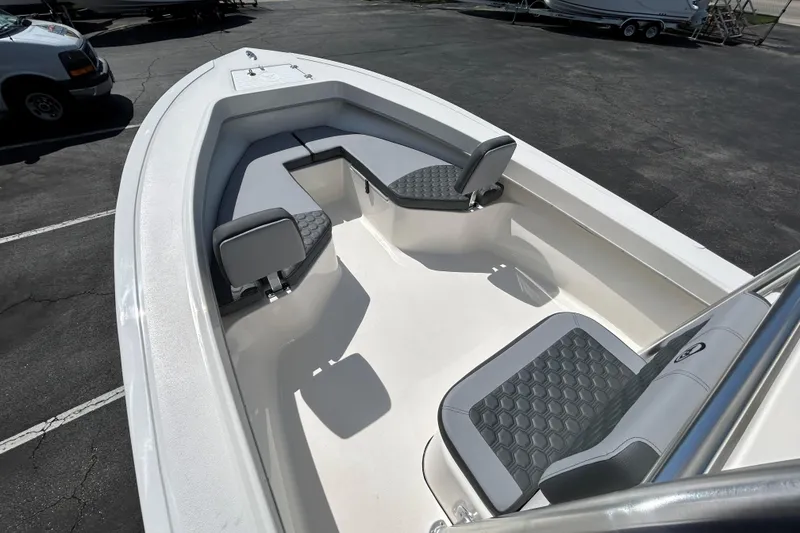 Slide: The Image of 2026 May-Craft 238 Offshore CC boat interior with cushioned seating and sleek design. - 22