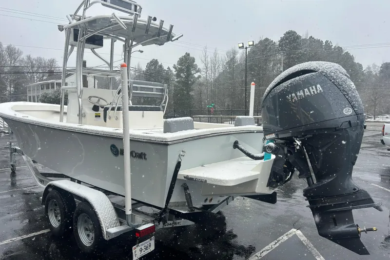 Slide: The Image of 2026 May-Craft 238 Offshore CC boat on trailer in snowy parking lot. - 4