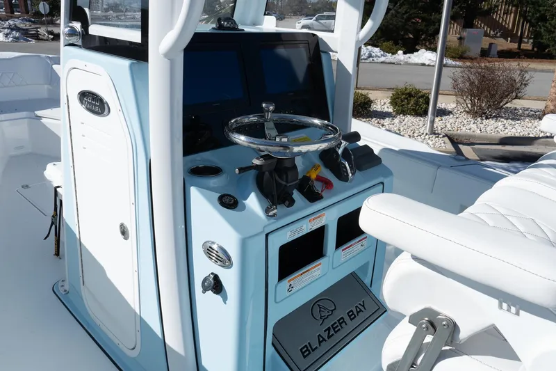 Slide: The Image of 2026 Blazer Bay Makaira 2600 boat console with steering wheel and controls. - 12