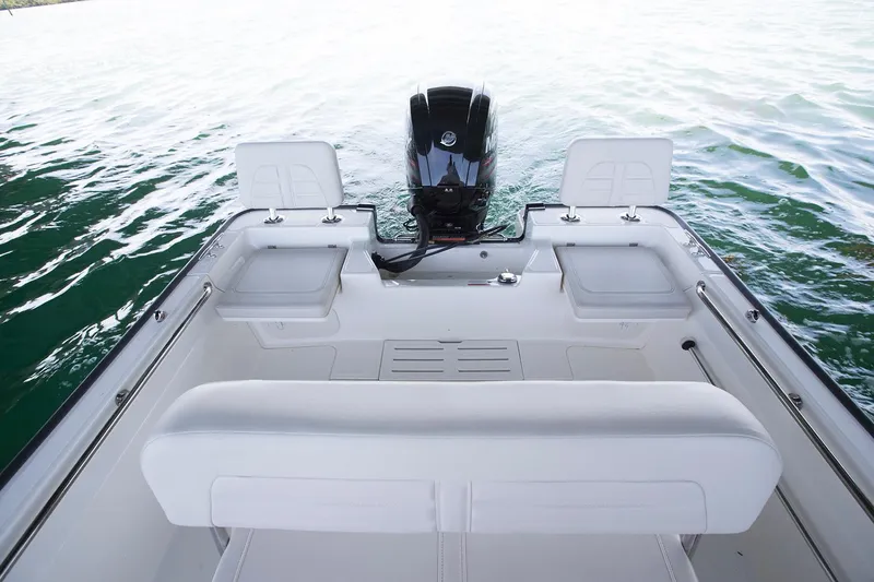 Slide: The Image of Manufacturer Provided Image: 2026 Boston Whaler 170 Montauk boat interior with outboard motor on water. - 25
