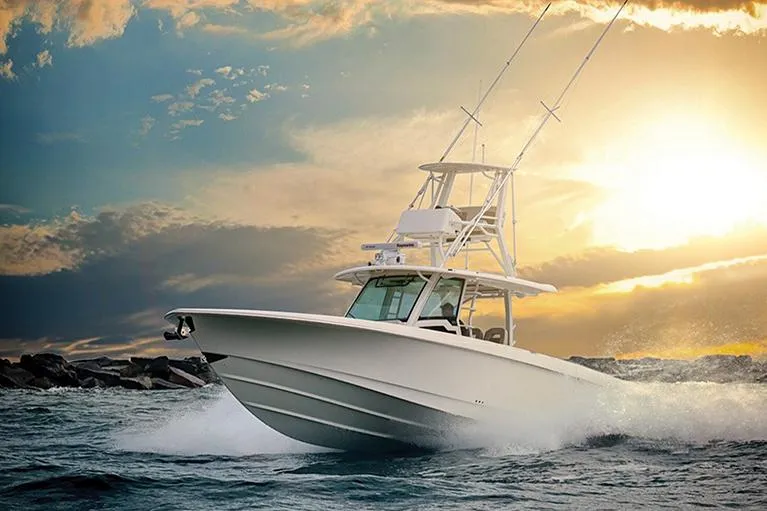 The Image of Manufacturer Provided Image: 2025 Boston Whaler 380 Outrage cruising at sunset on open water. - 0