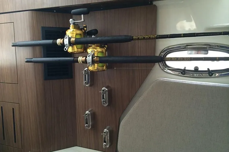 Slide: The Image of Manufacturer Provided Image: Fishing rods mounted inside 2025 Boston Whaler 380 Outrage cabin. - 18