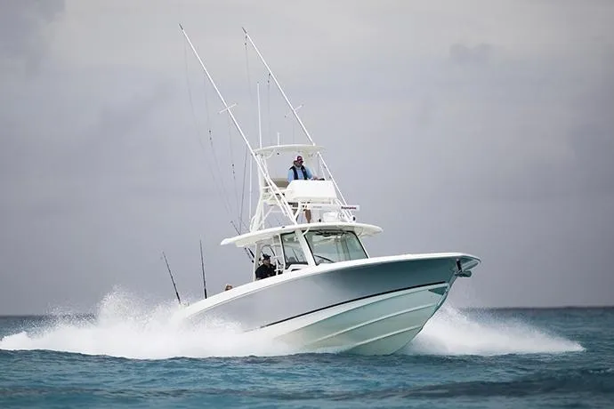 Slide: The Image of Manufacturer Provided Image: 2025 Boston Whaler 380 Outrage cruising on open water. - 2