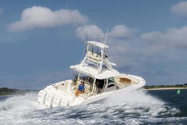 Slide: The Image of Manufacturer Provided Image: 2025 Boston Whaler 380 Outrage cruising on open water, showcasing powerful performance. - 3