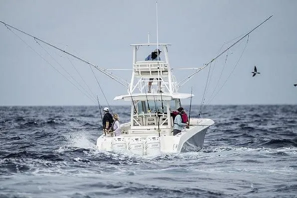 Slide: The Image of Manufacturer Provided Image: 2025 Boston Whaler 380 Outrage fishing boat navigating ocean waters. - 4