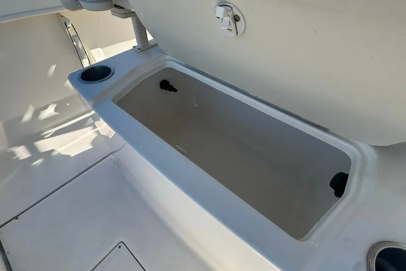 Slide: The Image of Open storage compartment on 2021 Bayliner Trophy T22CC boat deck. - 13