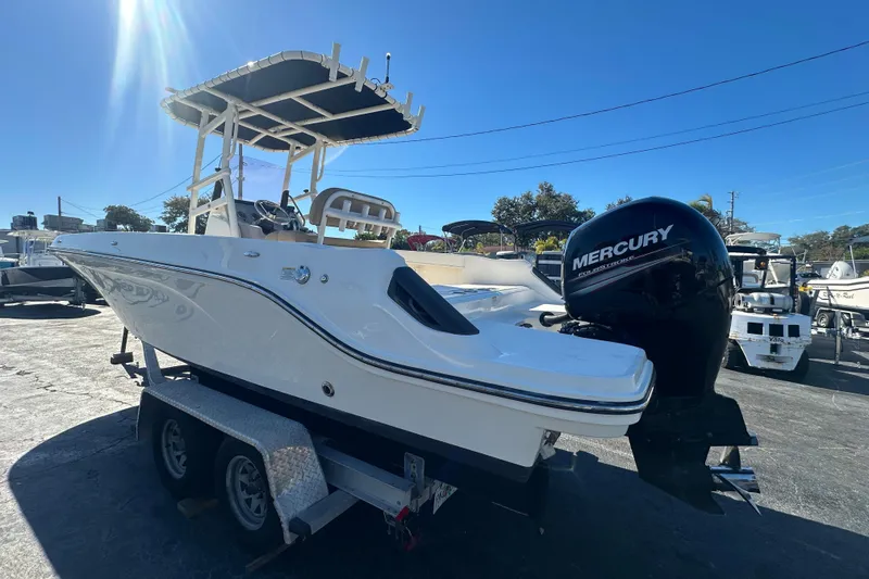 Slide: The Image of 2021 Bayliner Trophy T22CC boat with Mercury outboard engine on trailer. - 4
