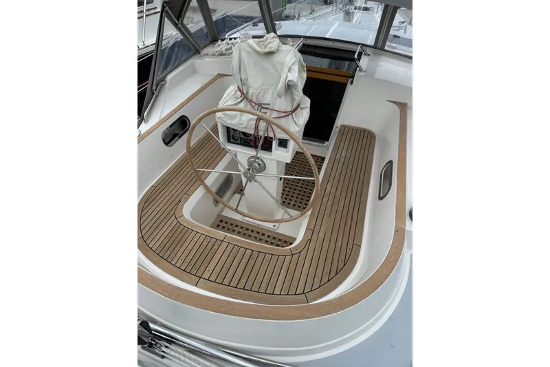 Slide: The Image of 1992 Taswell 43 All Season yacht cockpit with wooden deck and steering wheel. - 2