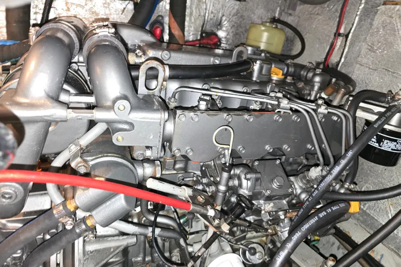 Slide: The Image of Engine compartment of a 1992 Taswell 43 All Season sailboat, showcasing detailed mechanical components. - 20
