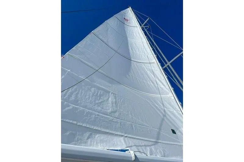 Slide: The Image of Sail of a 1992 Taswell 43 All Season yacht against a clear blue sky. - 25