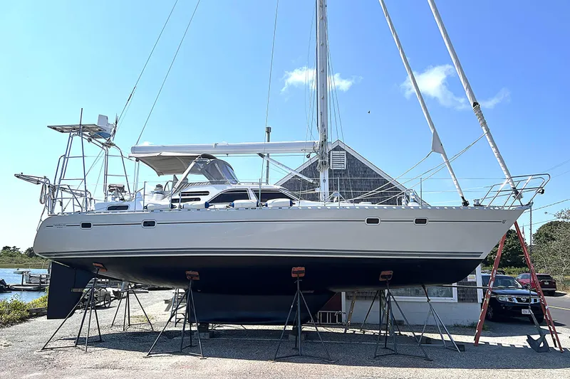 Slide: The Image of 1992 Taswell 43 All Season sailboat on stands, clear sky background. - 29
