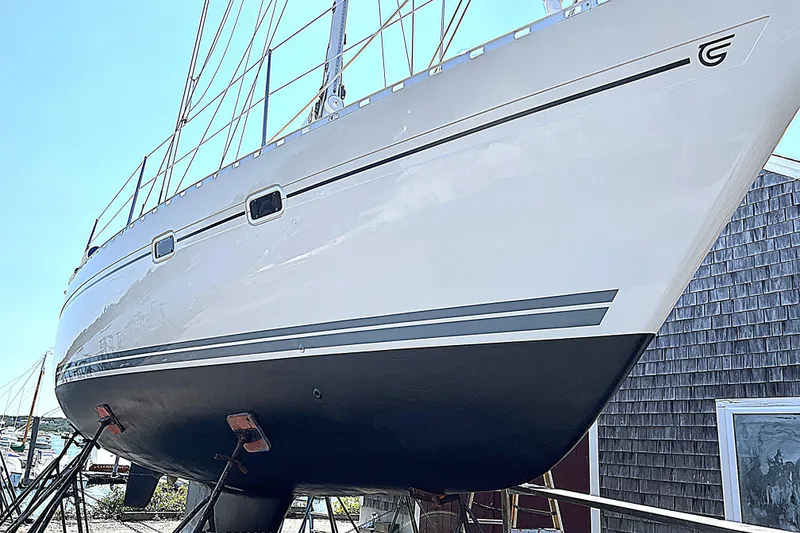 Slide: The Image of 1992 Taswell 43 All Season sailboat on dry dock, showcasing sleek hull design. - 32
