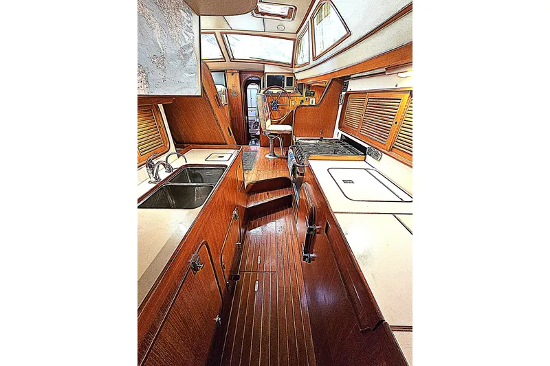 Slide: The Image of Interior of 1992 Taswell 43 All Season yacht with wooden cabinetry and modern amenities. - 8