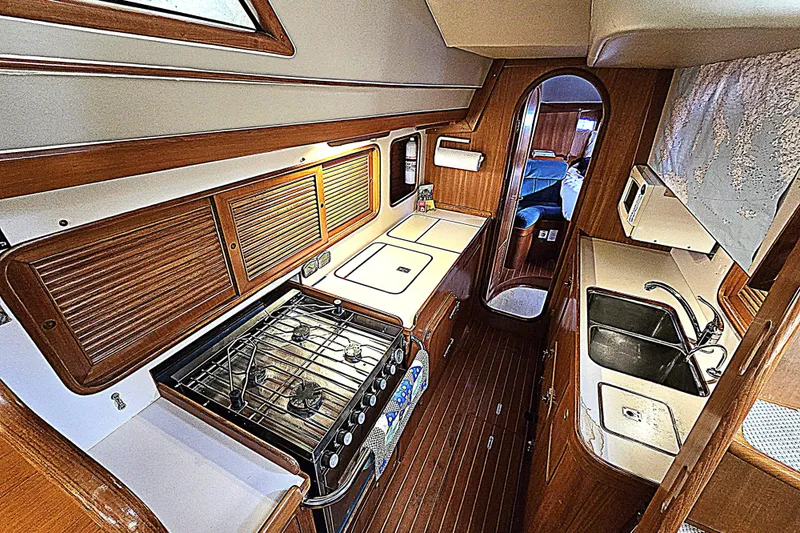 Slide: The Image of 1992 Taswell 43 All Season yacht interior with kitchen, stove, and sink. - 9