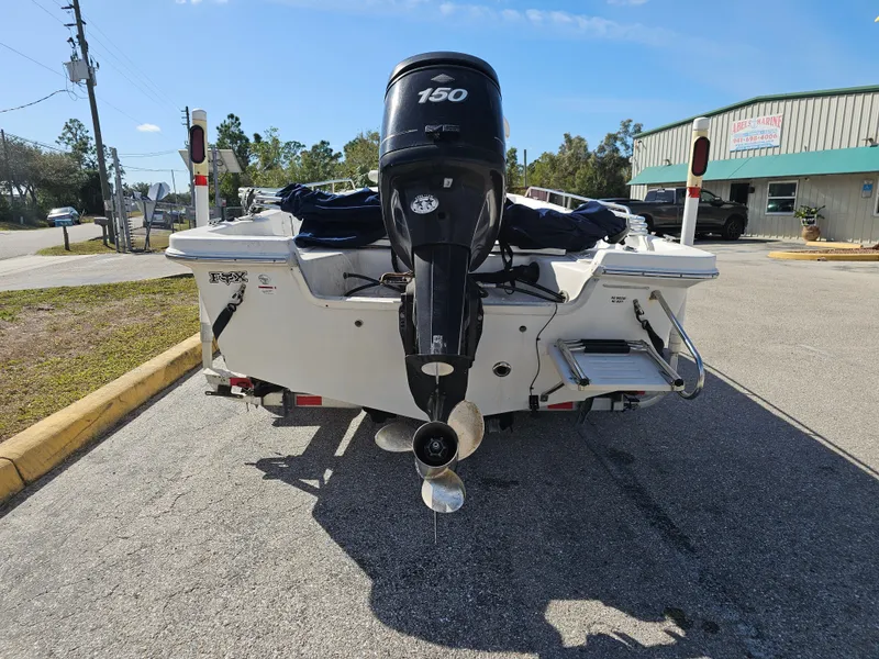 Slide: The Image of Rear view of a 2006 Sea Fox 195 Bay Fisher with outboard motor. - 1