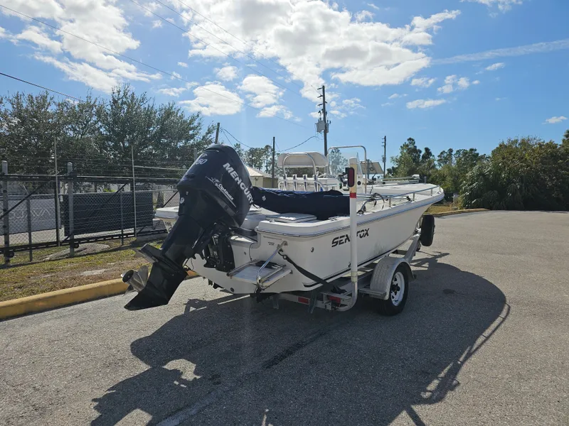 Slide: The Image of 2006 Sea Fox 195 Bay Fisher on trailer, sunny day. - 11