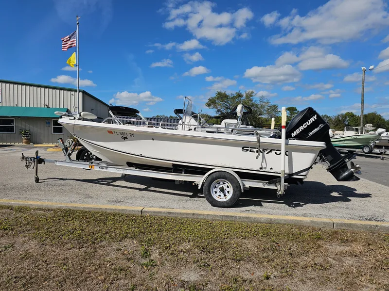 Slide: The Image of 2006 Sea Fox 195 Bay Fisher on trailer, blue sky. - 2