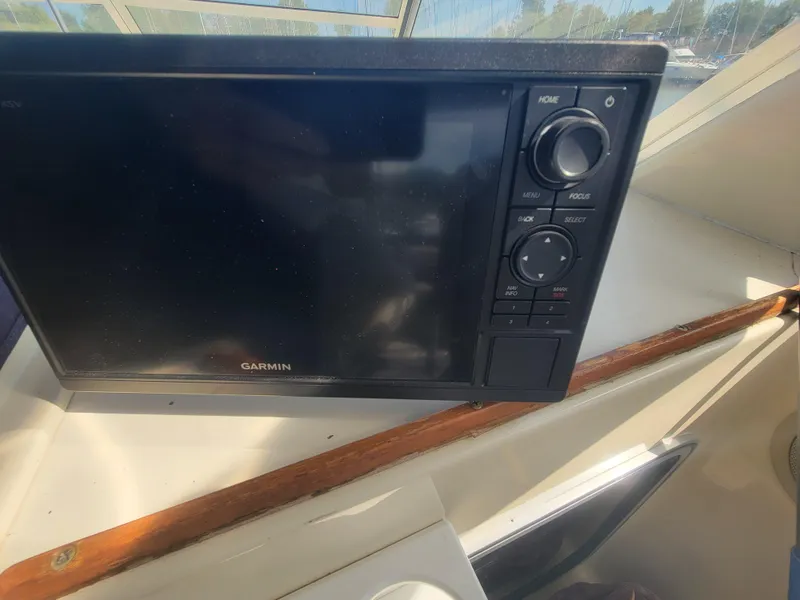 Slide: The Image of Garmin navigation system on 1986 Chris-Craft 381 Catalina boat dashboard. - 14