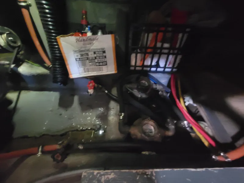 Slide: The Image of Engine compartment of 1986 Chris-Craft 381 Catalina with visible wiring and components. - 33
