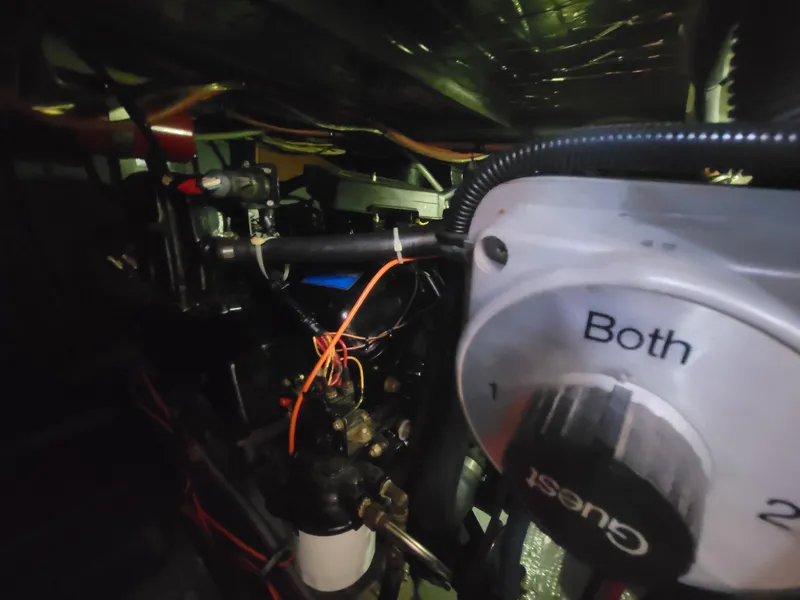 Slide: The Image of Engine compartment of a 1986 Chris-Craft 381 Catalina boat, showing wiring and control panel. - 34