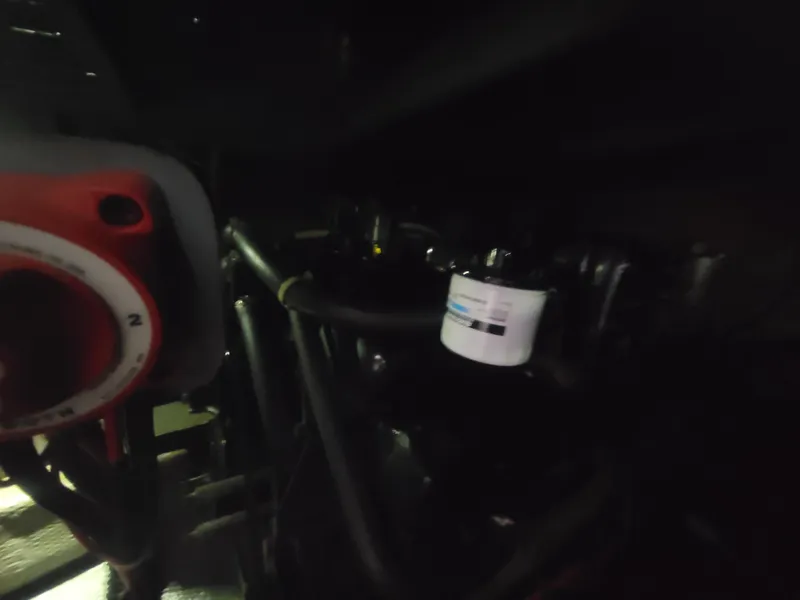 Slide: The Image of 1986 Chris-Craft 381 Catalina engine compartment with visible filter and wiring. - 35