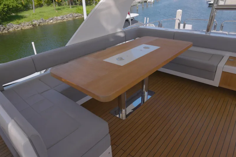 Slide: The Image of Luxurious 2014 Fairline Squadron 78 Custom yacht deck with elegant seating and wooden table. - 20