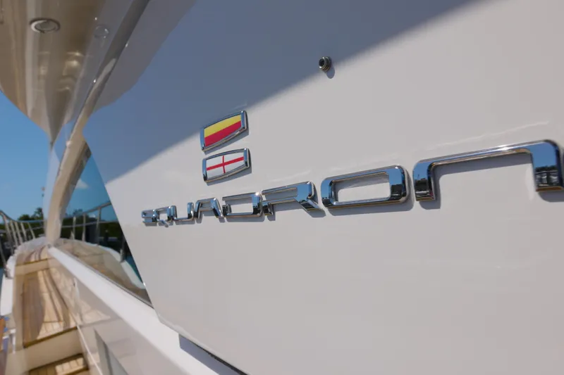 Slide: The Image of 2014 Fairline Squadron 78 Custom yacht with chrome lettering and flags. - 3
