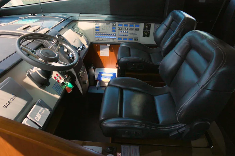 Slide: The Image of 2014 Fairline Squadron 78 Custom yacht cockpit with leather seats and advanced controls. - 4