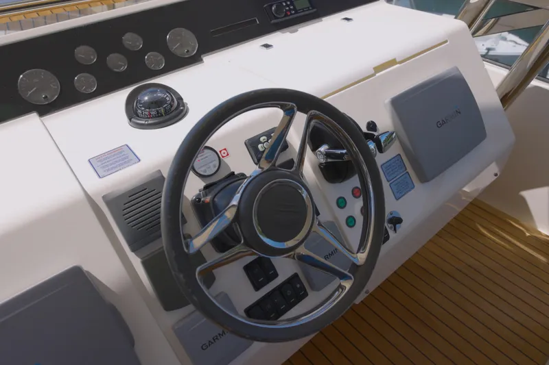Slide: The Image of Steering wheel and controls of 2014 Fairline Squadron 78 Custom yacht. - 5