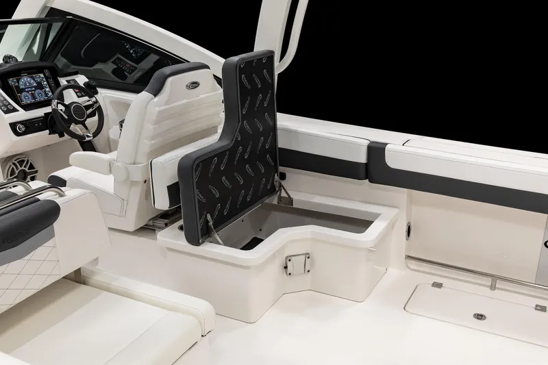 Slide: The Image of 2026 Robalo R277 Dual Console interior with storage compartment and modern dashboard. - 12