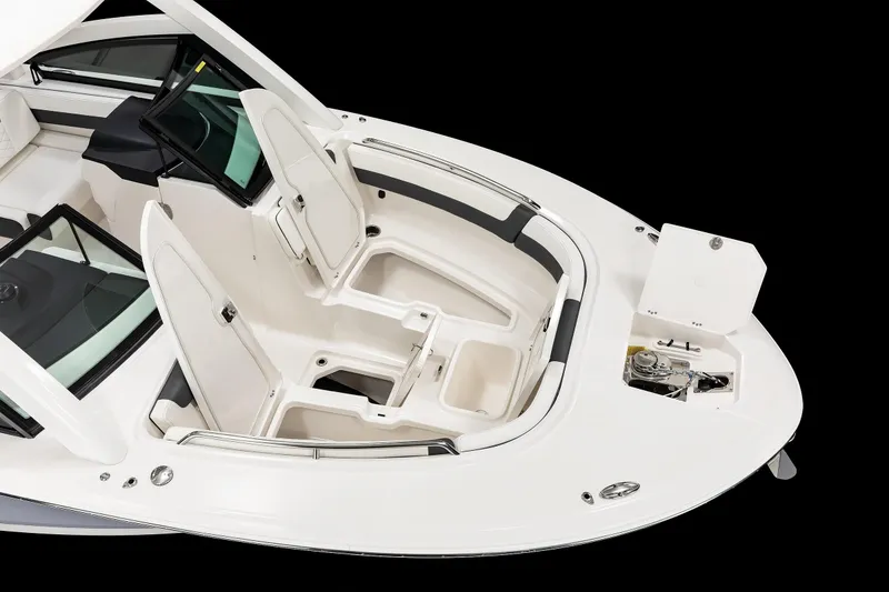 Slide: The Image of 2026 Robalo R277 Dual Console boat interior with seating and storage compartments. - 6