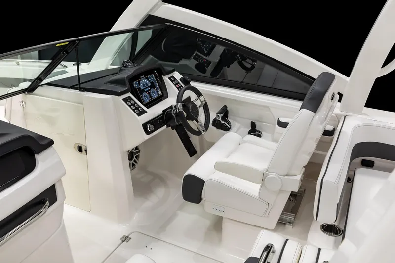 Slide: The Image of 2026 Robalo R277 Dual Console boat interior with modern dashboard and seating. - 7