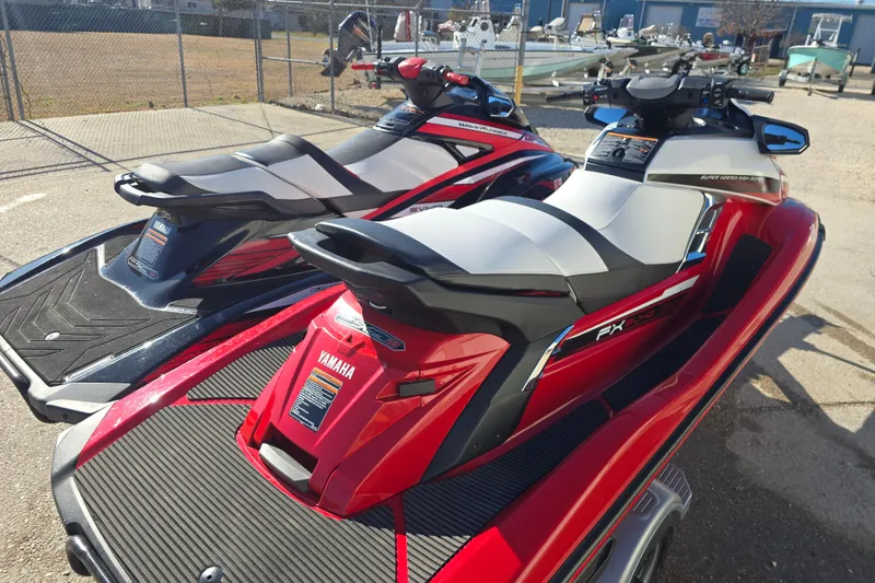 Slide: The Image of 2019 Yamaha WaveRunner GP1800R SVHO jet skis parked outdoors in a lot. - 10