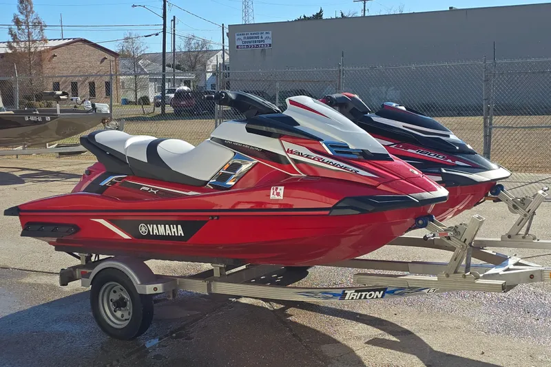 Slide: The Image of 2019 Yamaha WaveRunner GP1800R SVHO jet skis on trailers, parked outdoors. - 8