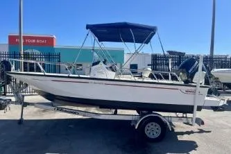 The Image of 2023 Boston Whaler 170 Montauk boat on trailer, outdoor display, sunny day. - 0