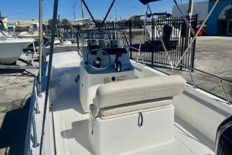 Slide: The Image of 2023 Boston Whaler 170 Montauk boat interior with seating and steering console. - 6