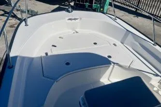 Slide: The Image of 2023 Boston Whaler 170 Montauk boat interior with seating and storage compartments. - 8