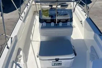 Slide: The Image of 2023 Boston Whaler 170 Montauk boat interior with seating and storage. - 9