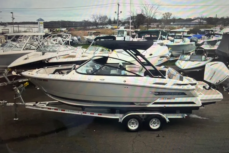 The Image of 2024 Monterey 255SS Super Sport boat on trailer in marina setting. - 1