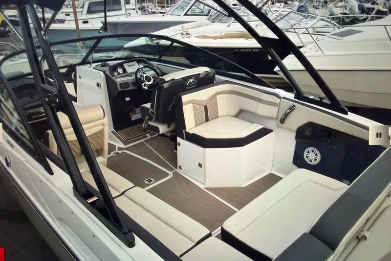 Slide: The Image of 2024 Monterey 255SS Super Sport boat interior with luxurious seating and modern dashboard. - 12