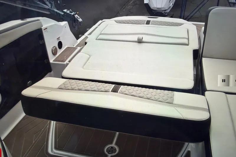 Slide: The Image of 2024 Monterey 255SS Super Sport boat interior with cushioned seating and sleek design. - 16