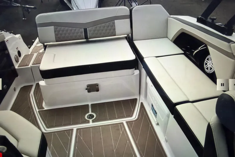 Slide: The Image of 2024 Monterey 255SS Super Sport boat interior with cushioned seating and sleek design. - 18