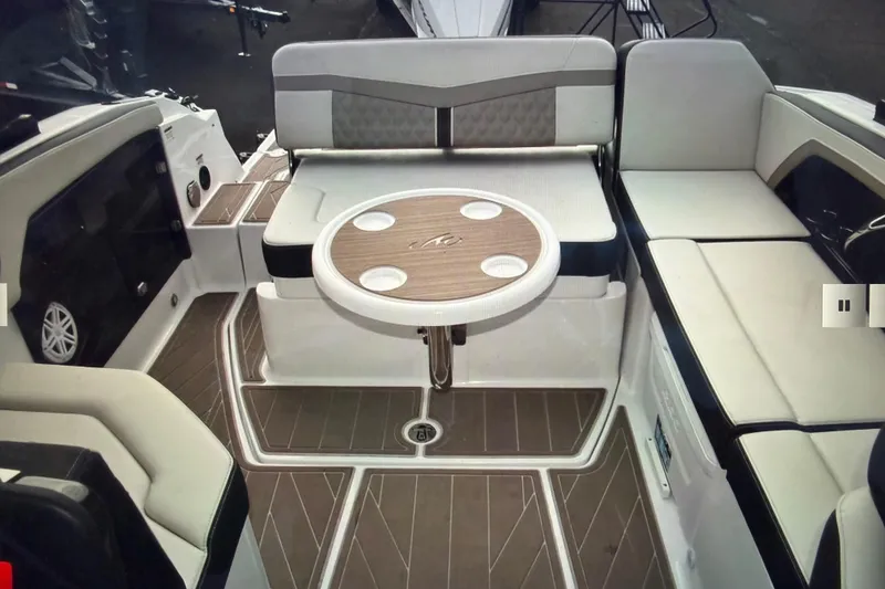Slide: The Image of 2024 Monterey 255SS Super Sport boat interior with seating and round table. - 19