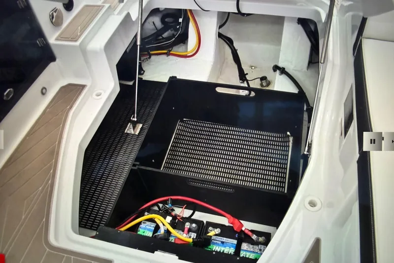Slide: The Image of 2024 Monterey 255SS Super Sport engine compartment with visible wiring and battery setup. - 21