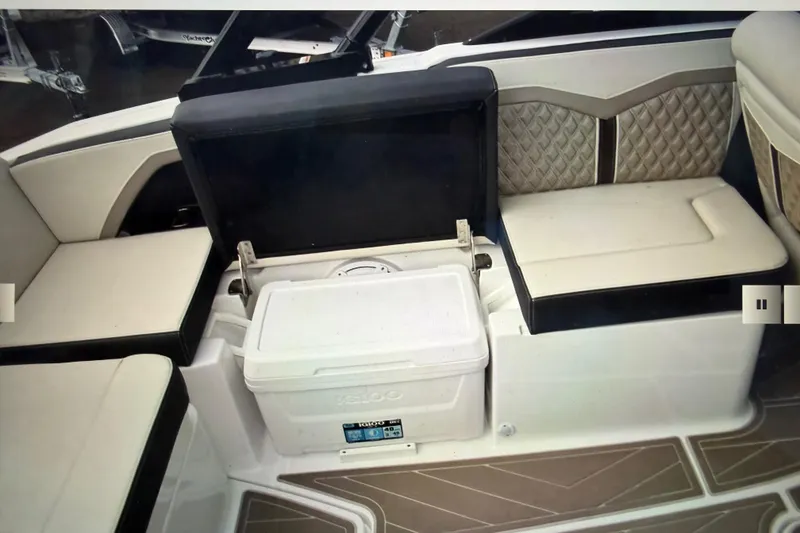 Slide: The Image of 2024 Monterey 255SS Super Sport boat interior with seating and cooler storage. - 28