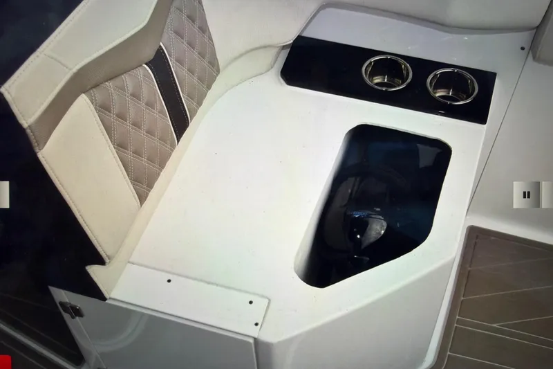 Slide: The Image of 2024 Monterey 255SS Super Sport boat interior with cup holders and quilted seating. - 31