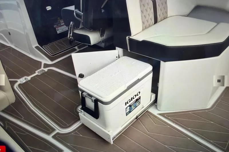 Slide: The Image of 2024 Monterey 255SS Super Sport interior with Igloo cooler and stylish seating. - 32